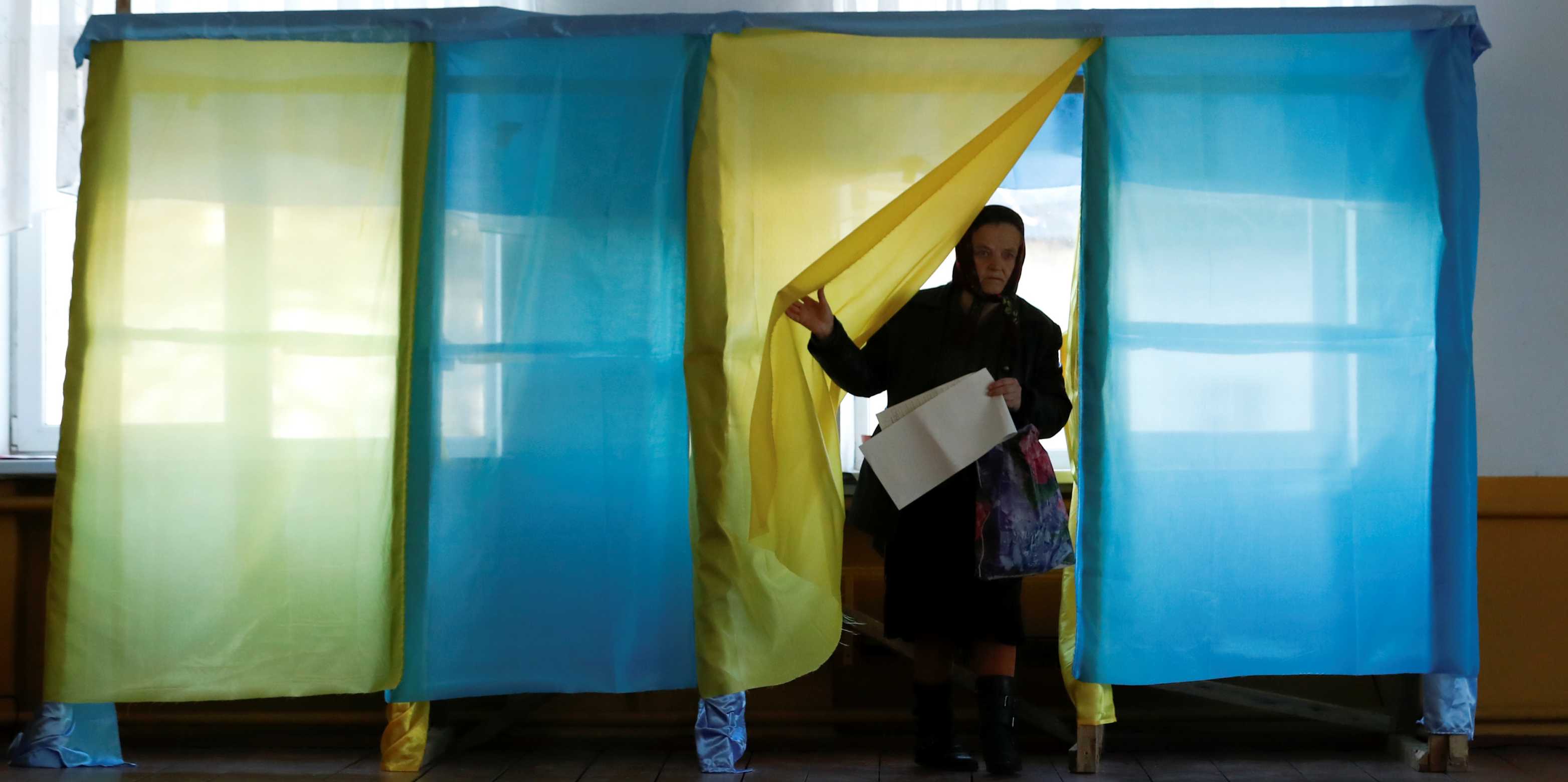 A woman at a polling station during a presidential election in the village of Kosmach, Ukraine in March 2019